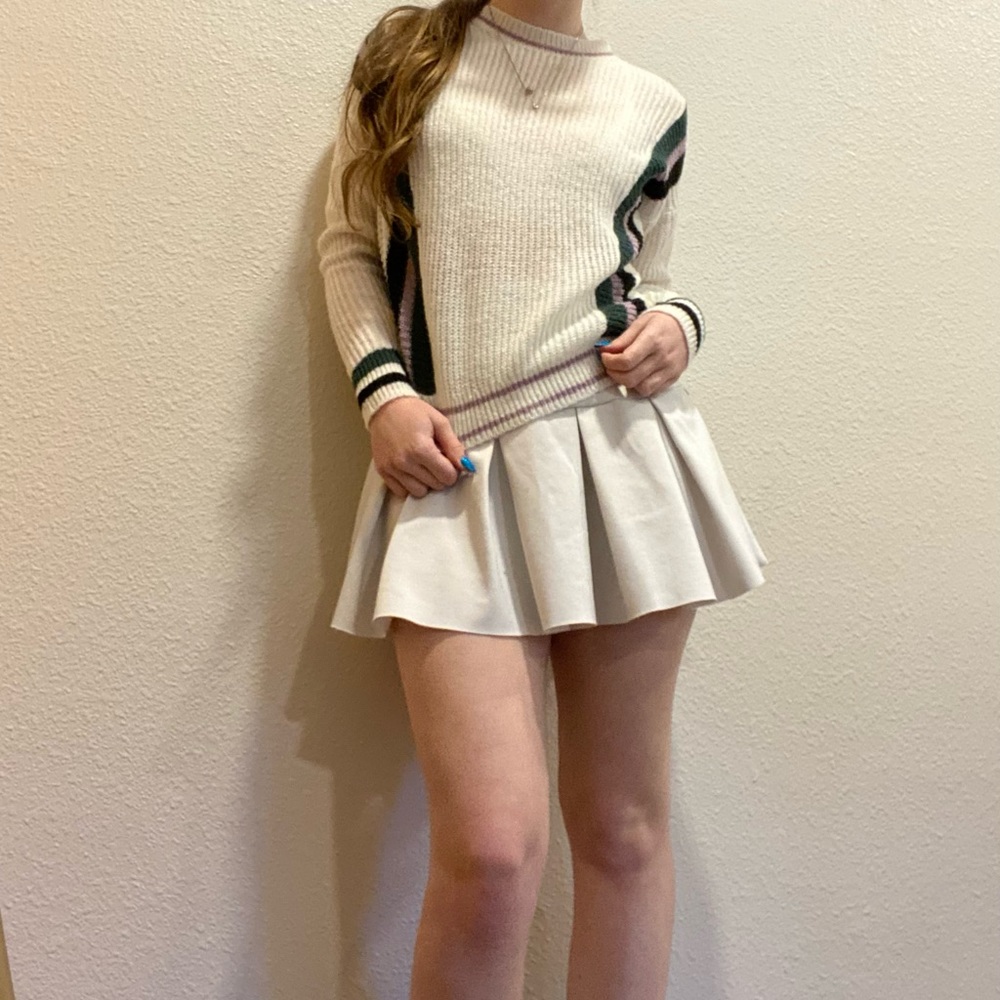 green, purple, white sweater